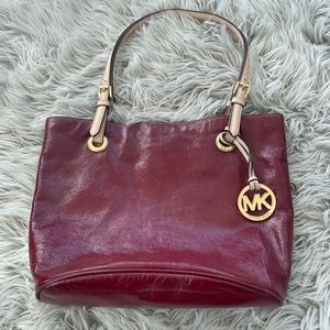 Michael Kors women’s dark red leather handbag.